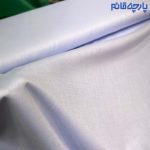 پارچه مردانه پیراهنی مردانه ساده تترون تایلندی بافت جناقی رنگ آبی روشن آسمانی.