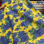پارچه بهاره و تابستانه وال طرحدار کره خاص زمینه زرد گل آبی نفتی .