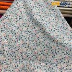 پارچه بهاره و تابستانه وال طرحدار کره ریز گل رنگ سرمه ای صورتی.