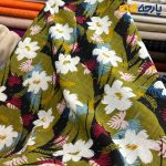 پارچه بهاره و تابستانه وال طرحدار کره زمینه سبز مشکی گل متوسط سفید