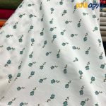 پارچه بهاره و تابستانه وال طرحدار کره زمینه سفید گل سبز ریز