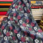 پارچه بهاره و تابستانه وال طرحدار کره پر گل زمینه سرمه ای گل سفید و رنگی .
