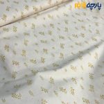 پارچه بهاره و تابستانه کتان نخ طرحدار زمینه کرم روشن طرح برگی رنگ خردلی طلایی