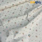 پارچه بهاره و تابستانه کتان نخ طرحدار زمینه شیری رنگ گل ریز نارنجی
