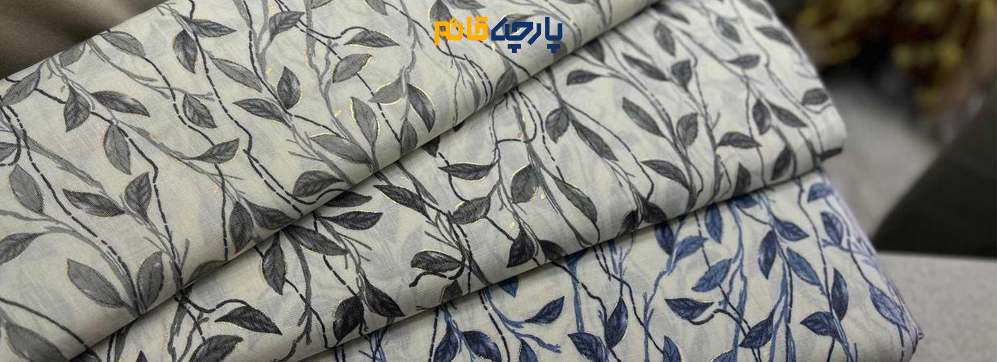 پارچه_نخی_باتیک_هندی_گل_و_برگ_طوسی_سورمه_ای
