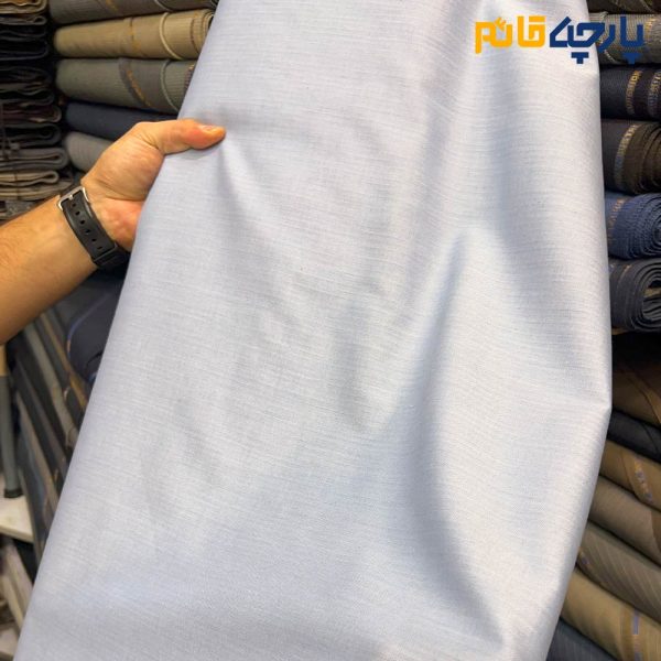 پارچه مردانه پیراهنی مردانه ساده تترون تایلندی بافت خاویاری درشت رنگ آبی آسمانی خاص