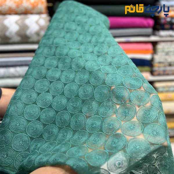 پارچه مجلسی تور کتان زمینه اورگاندی رنگ سبز خاص تیفانی طرح دایره ای منظم