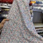 پارچه بهاره و تابستانه کتان نخ کره ای ظریف کشی طرحدار گل ریز رنگ شاد