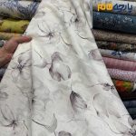 پارچه بهاره تابستانه لینن طرحدار ایتالیایی زمینه سفید آفوایت (سفید شیری) گل رنگ بنفش پوست پیازی