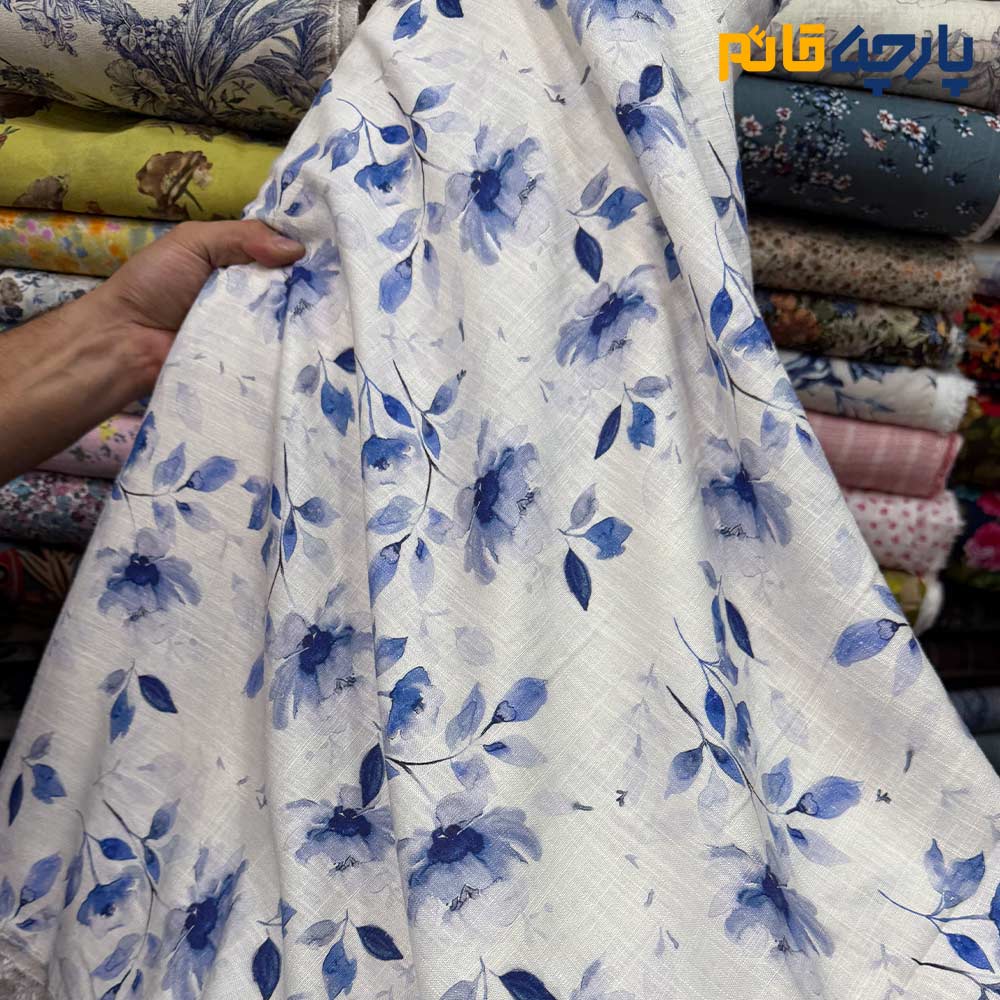 پارچه بهاره تابستانه لینن طرحدار ایتالیایی زمینه سفید گل آبی کاربنی