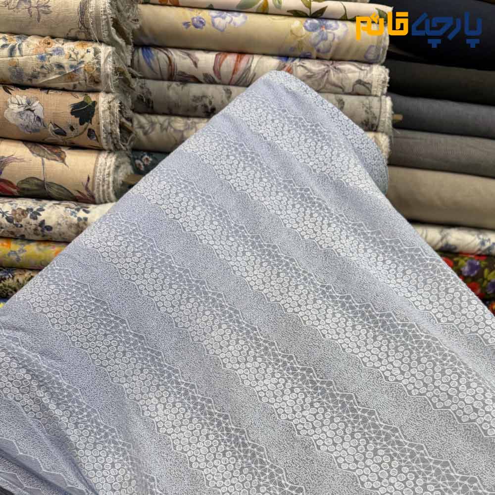 پارچه مجلسی تور کتان طرح دایره ریز و اشکال هندسی رنگ آبی آسمانی روشن