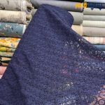 پارچه مجلسی تور کتان کره ای رنگ سرمه ای روشن طرح دایره ریز و متوسط