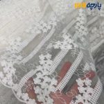 پارچه مجلسی تور کتان ایتالیایی طرح گل و شاخه رنگ سفید آفوایت