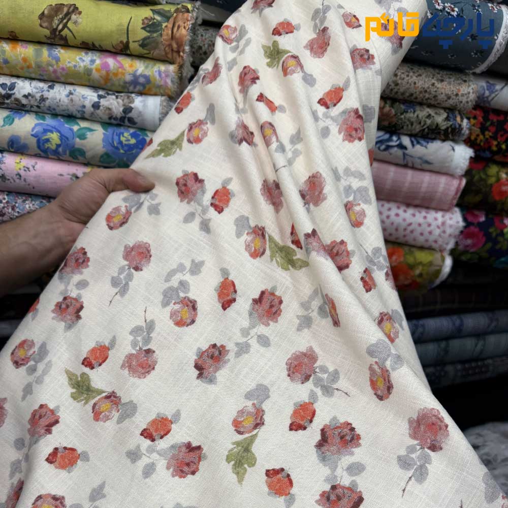 پارچه بهاره تابستانه لینن طرحدار ایتالیایی زمینه شیری کرم روشن گل قرمز خوشرنگ