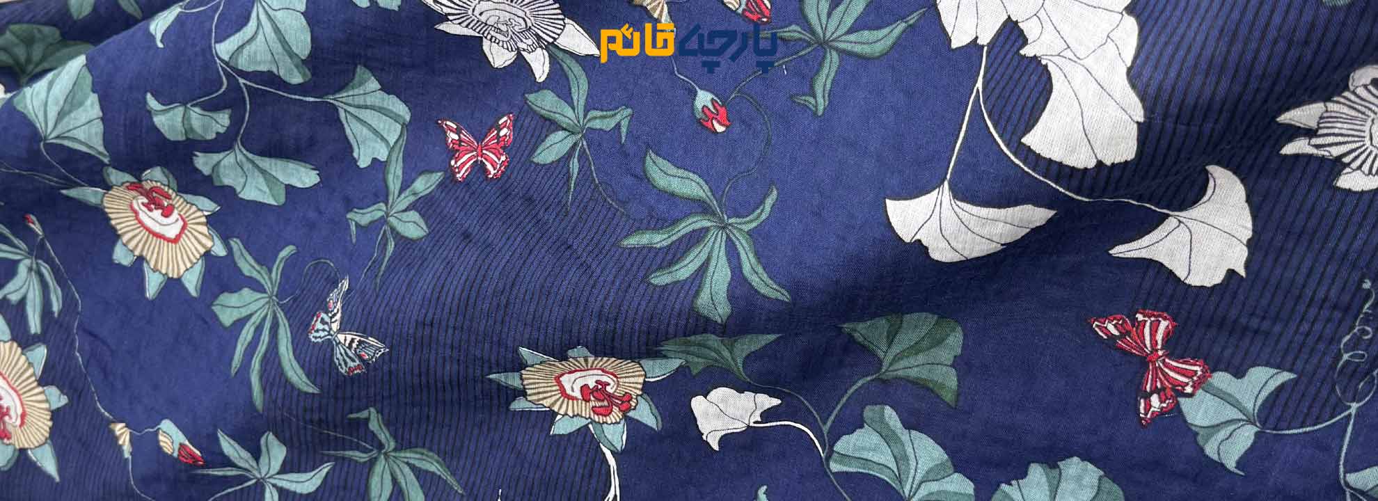 پارچه وال نخ گلدار زمینه سرمه ای گل دار