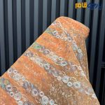 پارچه مجلسی دانتل کره ای زمینه نارنجی متوسط گل رنگی