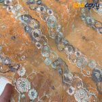 پارچه مجلسی دانتل کره ای زمینه نارنجی متوسط گل رنگی