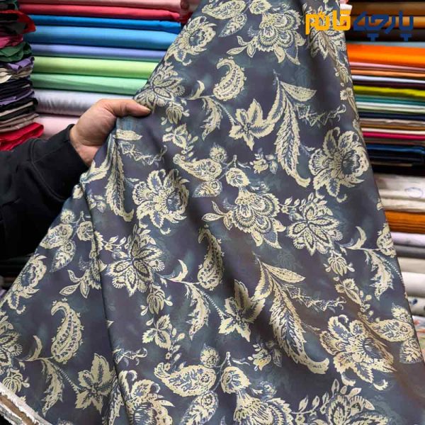 پارچه بهاره تابستانه سیلک نخ طرحدار زمینه رنگ سرمه ای طرح کرم داماس