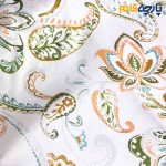 پارچه مجلسی سیلک طرحدار طرح بته جقه سبز و نارنجی زمینه روشن