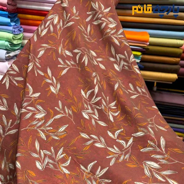 پارچه بهاره تابستانه سیلک نخ طرحدار زمینه رنگ آجری طرح برگ متوسط