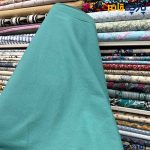 پارچه بهاره تابستانه لینن سفارشی ساده رنگ فیروزه ای متوسط(بنتون) عرض ۱۵۰