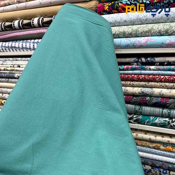 پارچه بهاره تابستانه لینن سفارشی ساده رنگ فیروزه ای متوسط(بنتون) عرض ۱۵۰