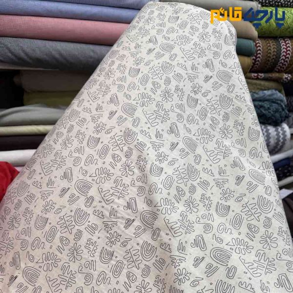 پارچه بهاره و تابستانه لینن طرحدار زمینه کرم طرح مشکی خاص عرض ۱۵۰