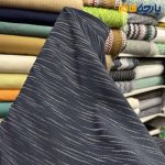پارچه مجلسی ژاکارد نخ خاص ۲ رو رنگ سرمه ای طرح خطی