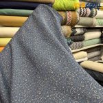 پارچه لینن سانتون طرحدارزمینه سرمه ای طرح کرم