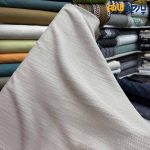 پارچه مجلسی ژاکارد نخ خاص ۲ رو رنگ کرم طرح خطی