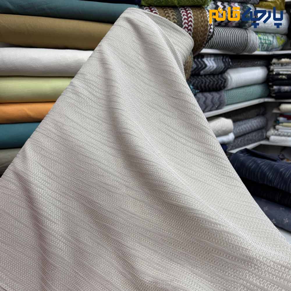 پارچه مجلسی ژاکارد نخ خاص ۲ رو رنگ کرم طرح خطی