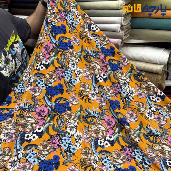 پارچه کرپ نخ ایتالیایی زمینه رنگ نارنجی طرح هاوایی