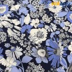 پارچه لینن طرحدار ریکو نخ ایتالیایی گلدار زمینه سرمه ای گل آبی سفید