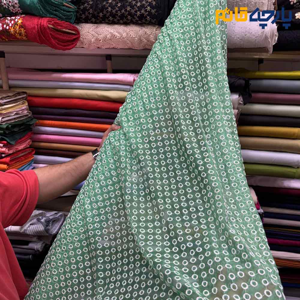 پارچه مجلسی تور کتان طرح دایره برجسته سبز روشن زمینه حریر اورگانز