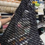 پارچه مجلسی دانتل کره ای رنگ مشکیبا لمه نقره ای گل برجسته ریز عرض ۱۵۰