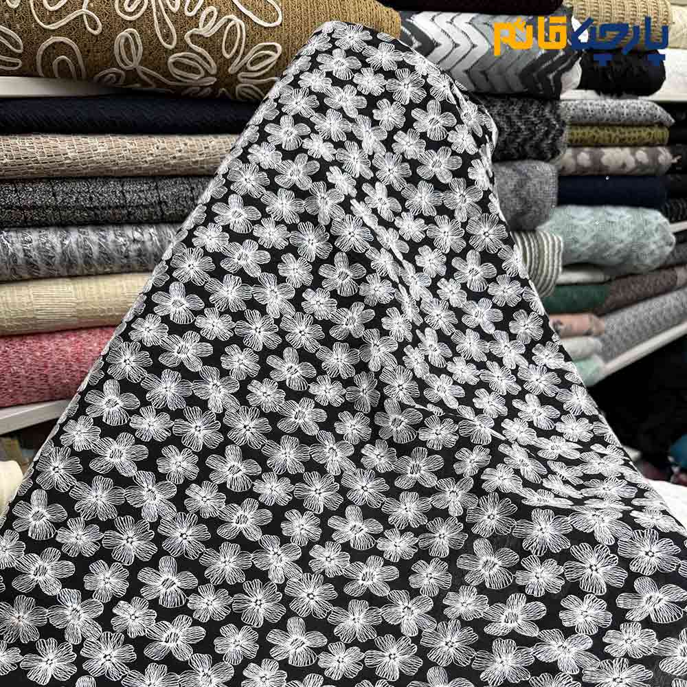 پارچه مجلسی تور کتان خاص زمینه مشکی با طرح سفید پر کار