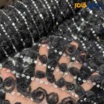 پارچه مجلسی دانتل کره ای رنگ مشکیبا لمه نقره ای گل برجسته ریز عرض ۱۵۰