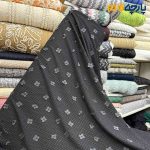 پارچه مجلسی تور کتان گل برجسته طرح ریز رنگ مشکی کشی