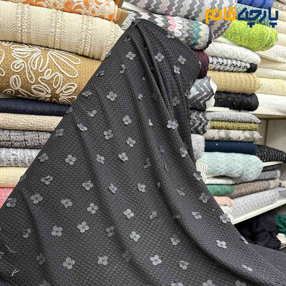 پارچه مجلسی تور کتان گل برجسته طرح ریز رنگ مشکی کشی