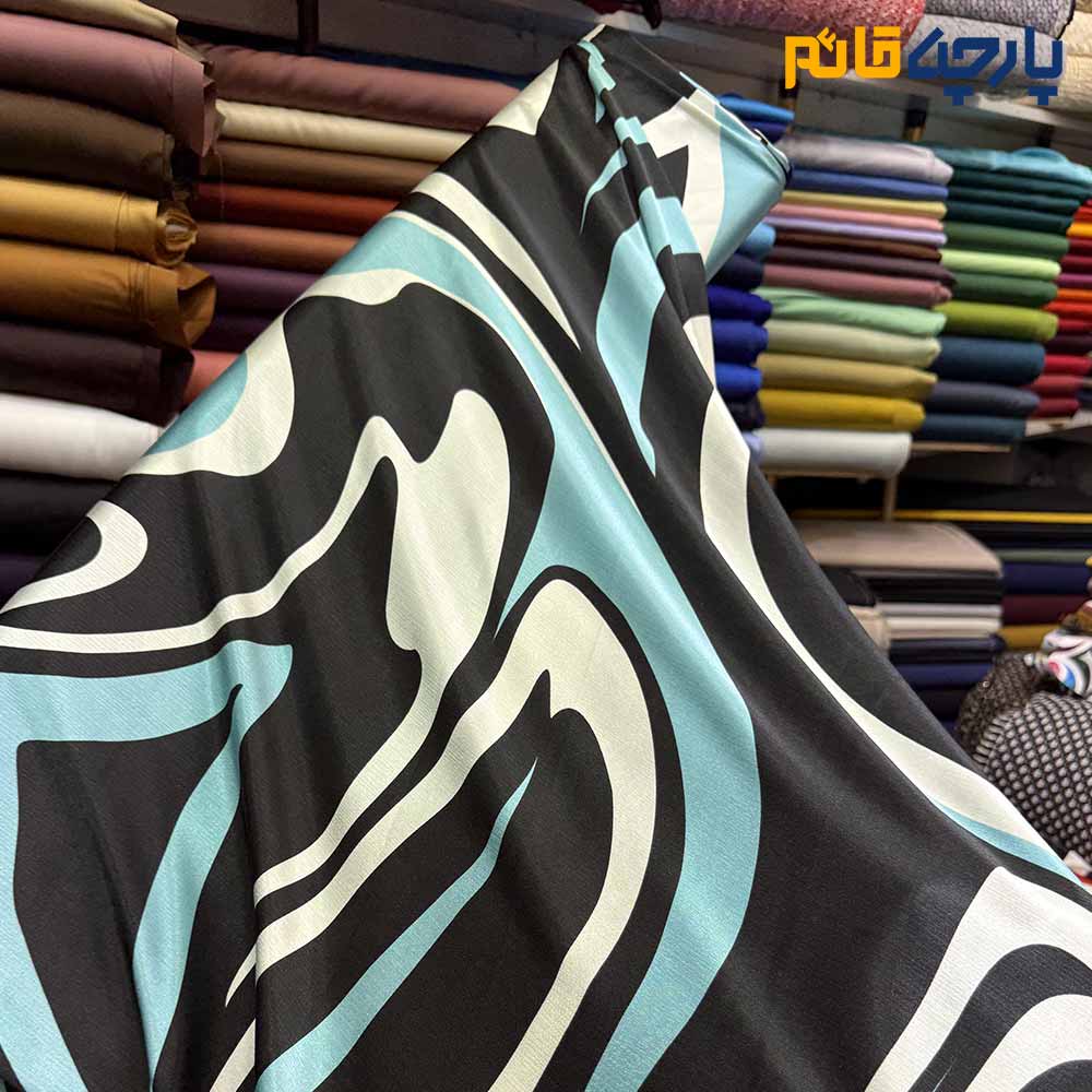 پارچه مجلسی سیلک ابریشم طرحدار طرح راه منحنی پیات رنگ آبی فیروزه ای و مشکی