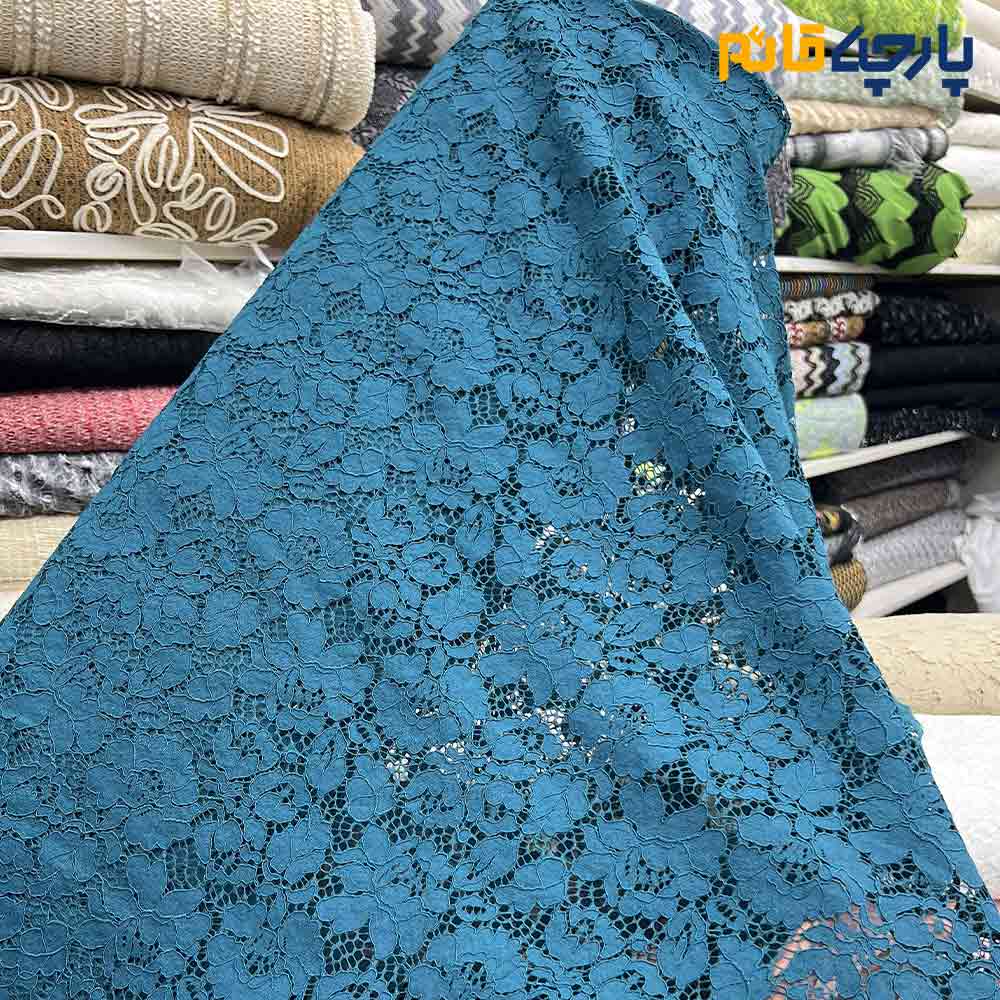 پارچه مجلسی دانتل کتان رنگ سبز فیروزه ای دو طرف حاشیه