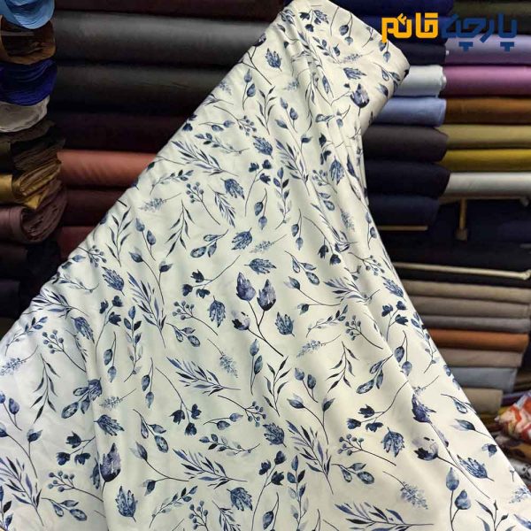 پارچه مجلسی سیلک ابریشم طرحدار طرح برگ آبی سرمه ای