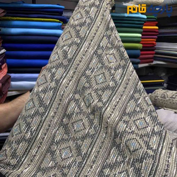 پارچه پاییزه و زمستانه بافت تریکو طرح موناکو ریز رنگ کرم طلایی با آبی