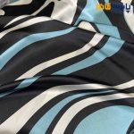 پارچه مجلسی سیلک ابریشم طرحدار طرح راه منحنی پیات رنگ آبی فیروزه ای و مشکی