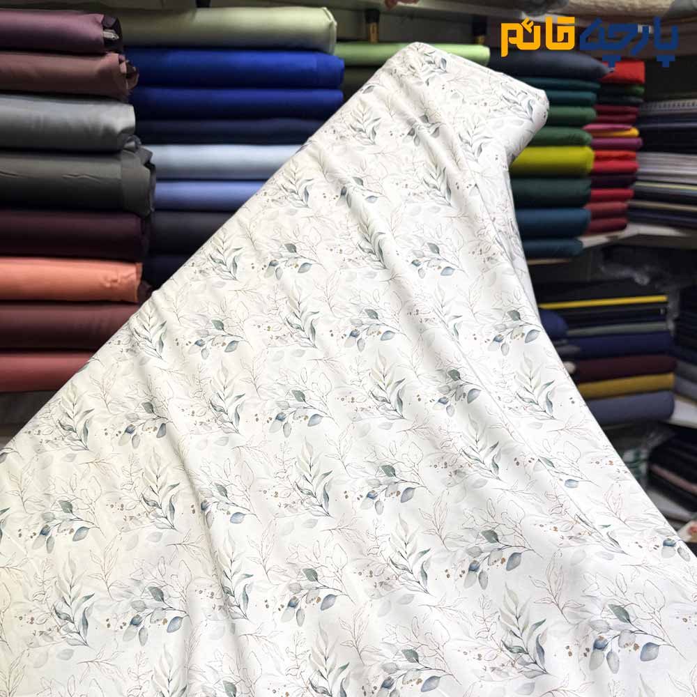 پارچه مجلسی سیلک ابریشم طرحدار زمینه سفید آفوایت طرح برگ سبز خطی