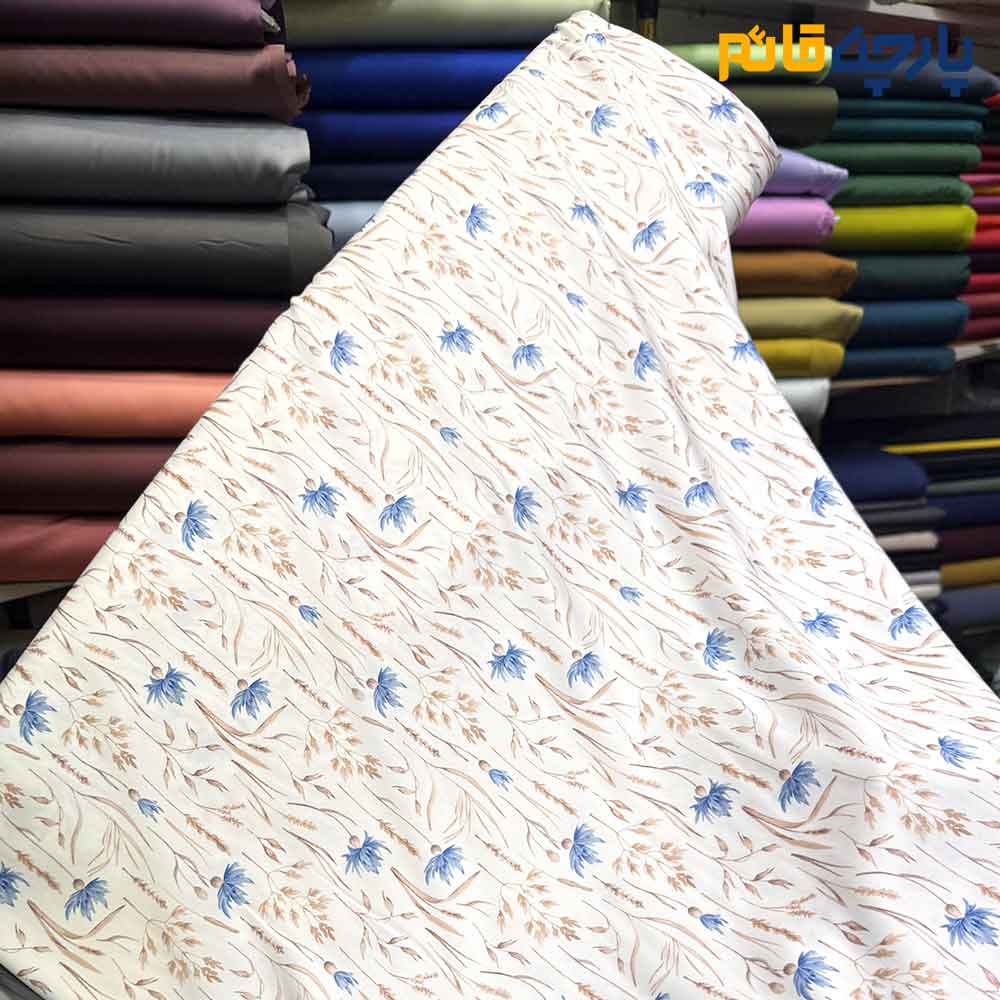 پارچه مجلسی سیلک ابریشم طرحدار زمینه سفید آفوایت گل و برگ خطی