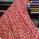 پارچه مجلسی سیلک ابریشم طرحدار زمینه قرمز گل ریز آبی