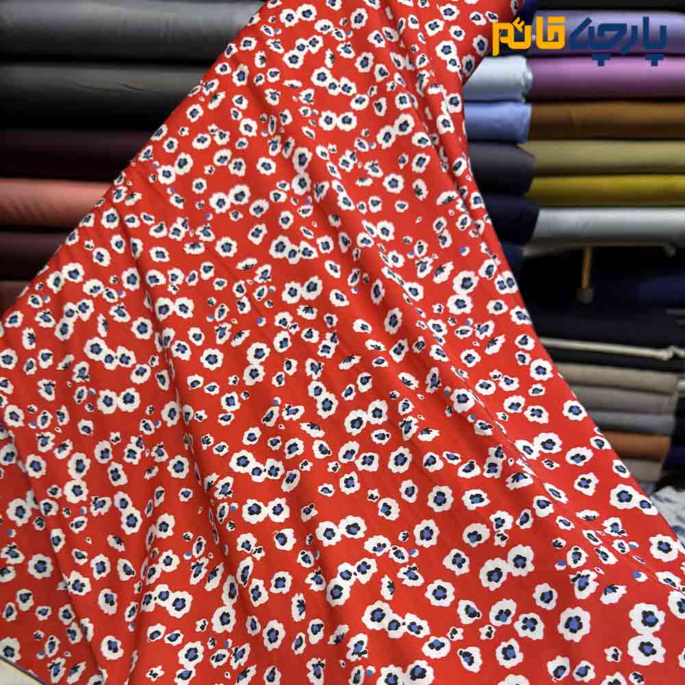 پارچه مجلسی سیلک ابریشم طرحدار زمینه قرمز گل ریز آبی