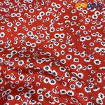 پارچه مجلسی سیلک ابریشم طرحدار زمینه قرمز گل ریز آبی